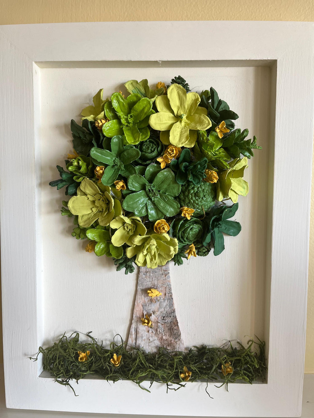Wall Hanging Hand Painted Pine Cones Tree with in shades of green with yellow flowers - frame is cream colored and is real wood