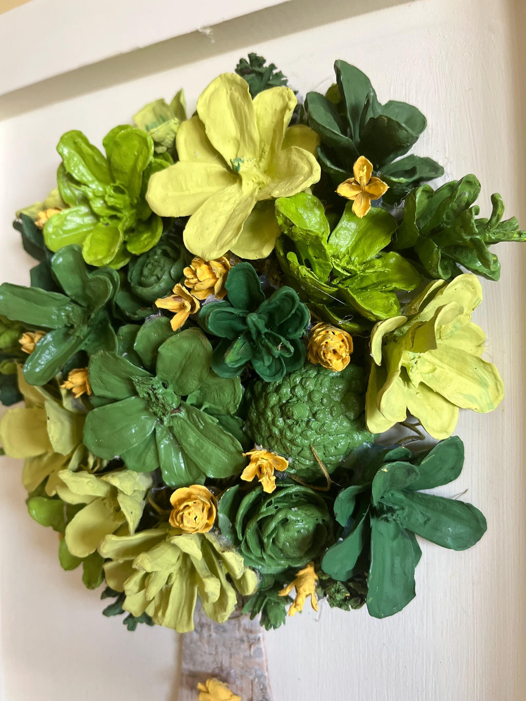Wall Hanging Hand Painted Pine Cones Tree with in shades of green with yellow flowers - frame is cream colored and is real wood