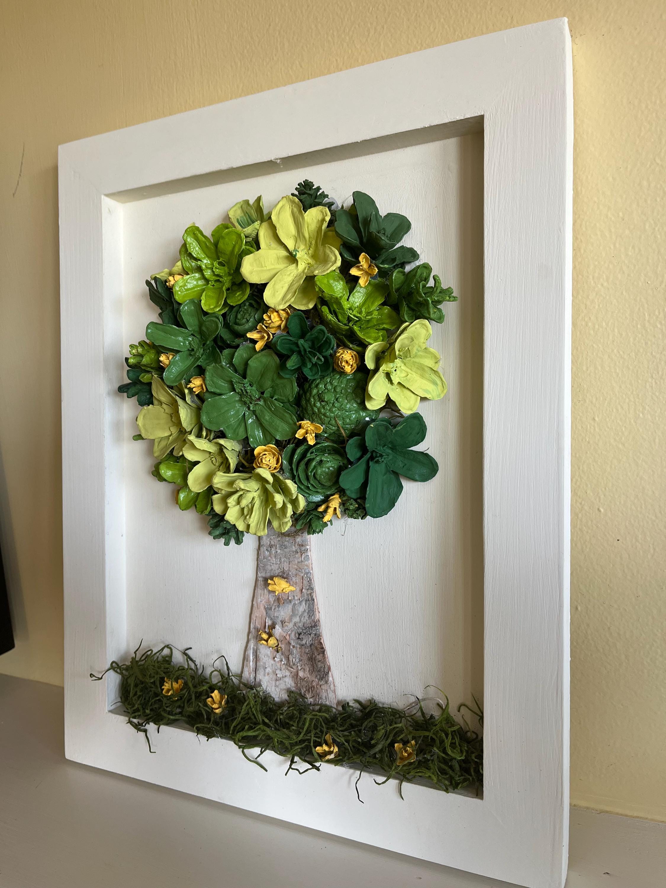 Wall Hanging Hand Painted Pine Cones Tree with in shades of green with yellow flowers - frame is cream colored and is real wood